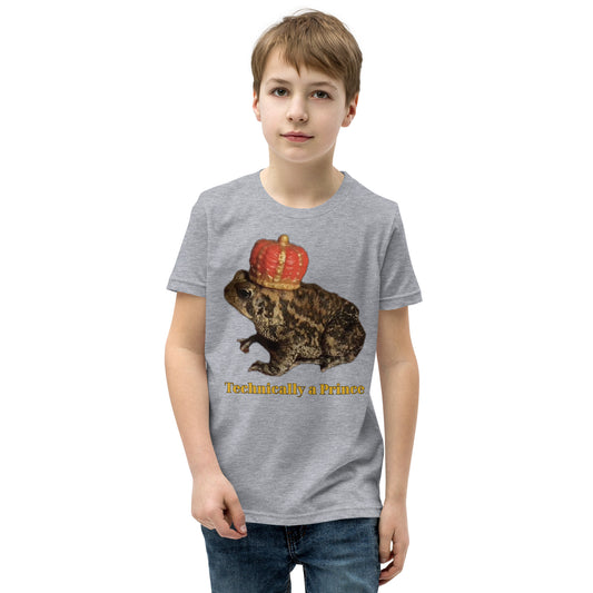 Youth t-shirt mockup — photograph of a pet toad wearing a tiny crown, captioned 'Technically a Prince'