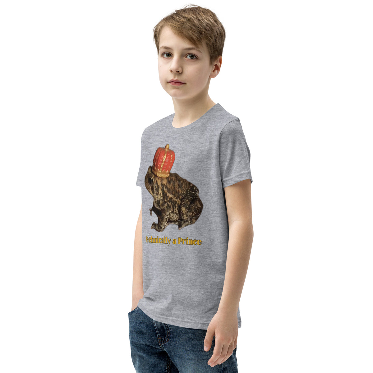 Youth t-shirt mockup — photograph of a pet toad wearing a tiny crown, captioned 'Technically a Prince'
