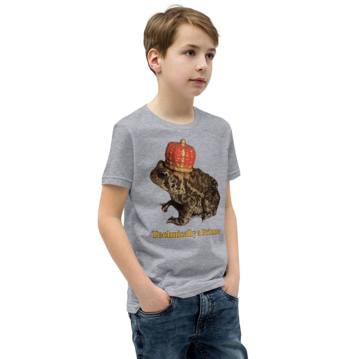 Youth t-shirt mockup — photograph of a pet toad wearing a tiny crown, captioned 'Technically a Prince'