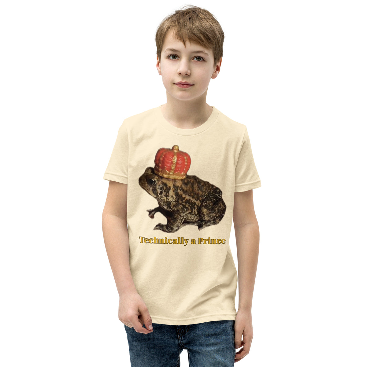 Youth t-shirt mockup — photograph of a pet toad wearing a tiny crown, captioned 'Technically a Prince'