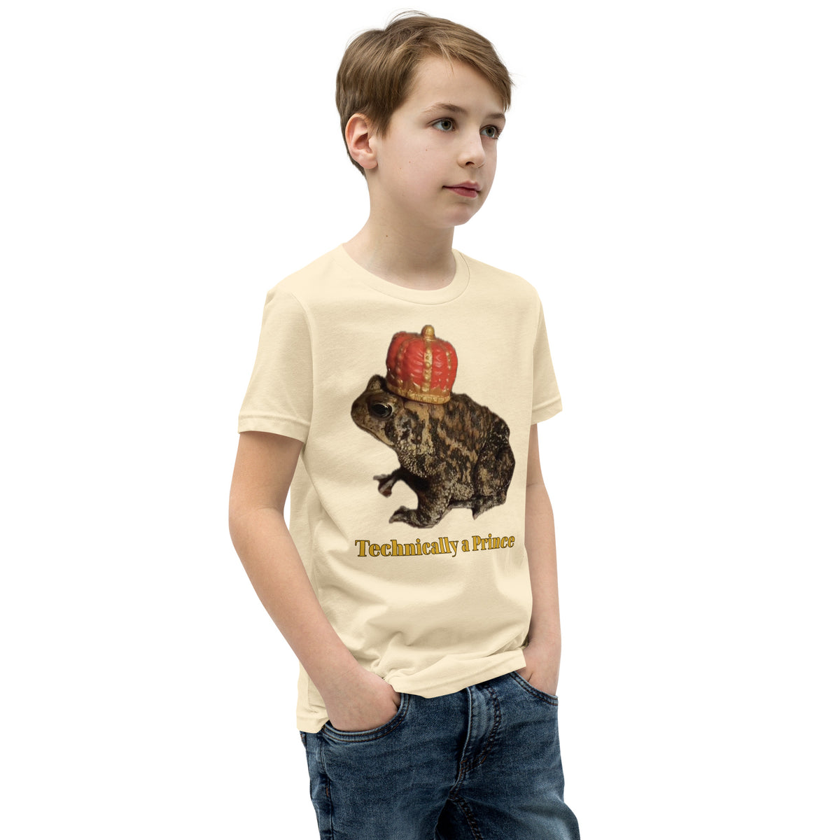 Youth t-shirt mockup — photograph of a pet toad wearing a tiny crown, captioned 'Technically a Prince'